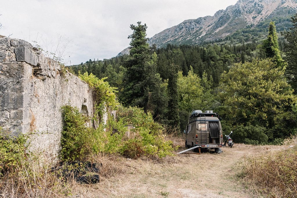 camping next to an abandoned stone house on a greek island