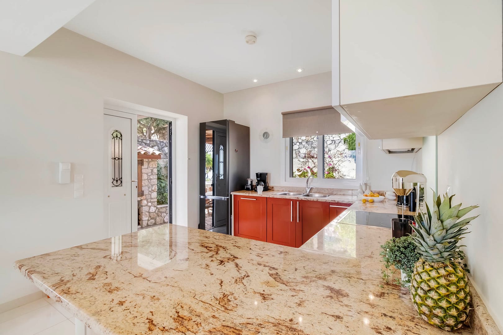 door exiting from the kitchen to the outdoor terrace