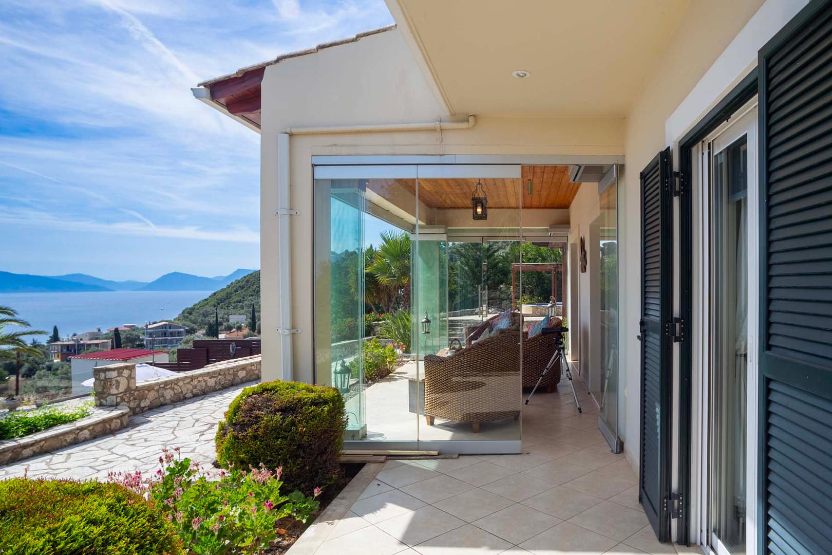 the glass doors of the veranda are fully retractable