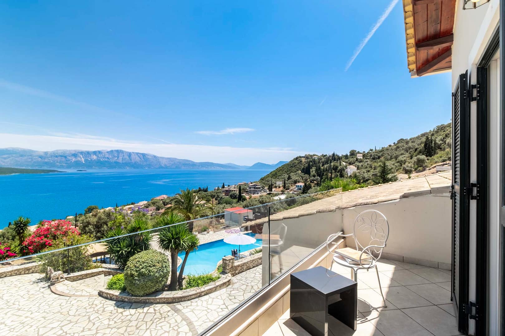 the master bedroom has great views of the property, pool and the sea of the Lefkada's East Coast