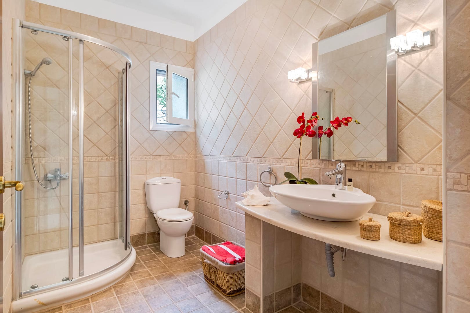 tiled bathroom with shower cabin at the ground floor