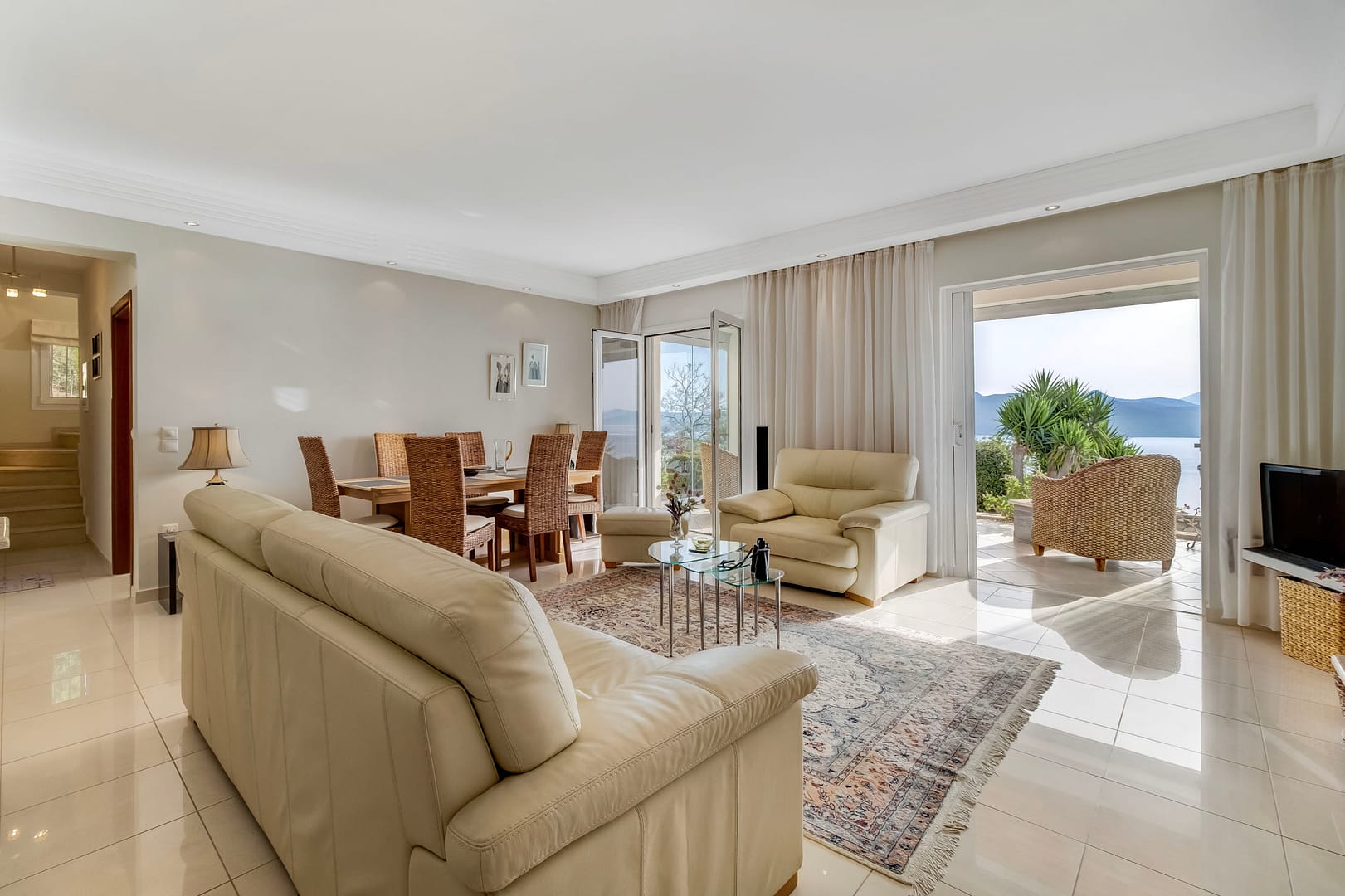 views from the kitchen to the living area and stairs leading to the main bedroom